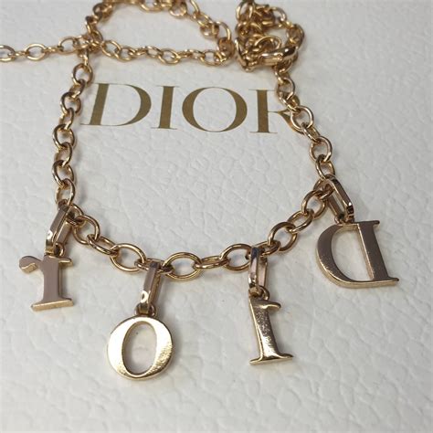 dior gold letter necklace|More.